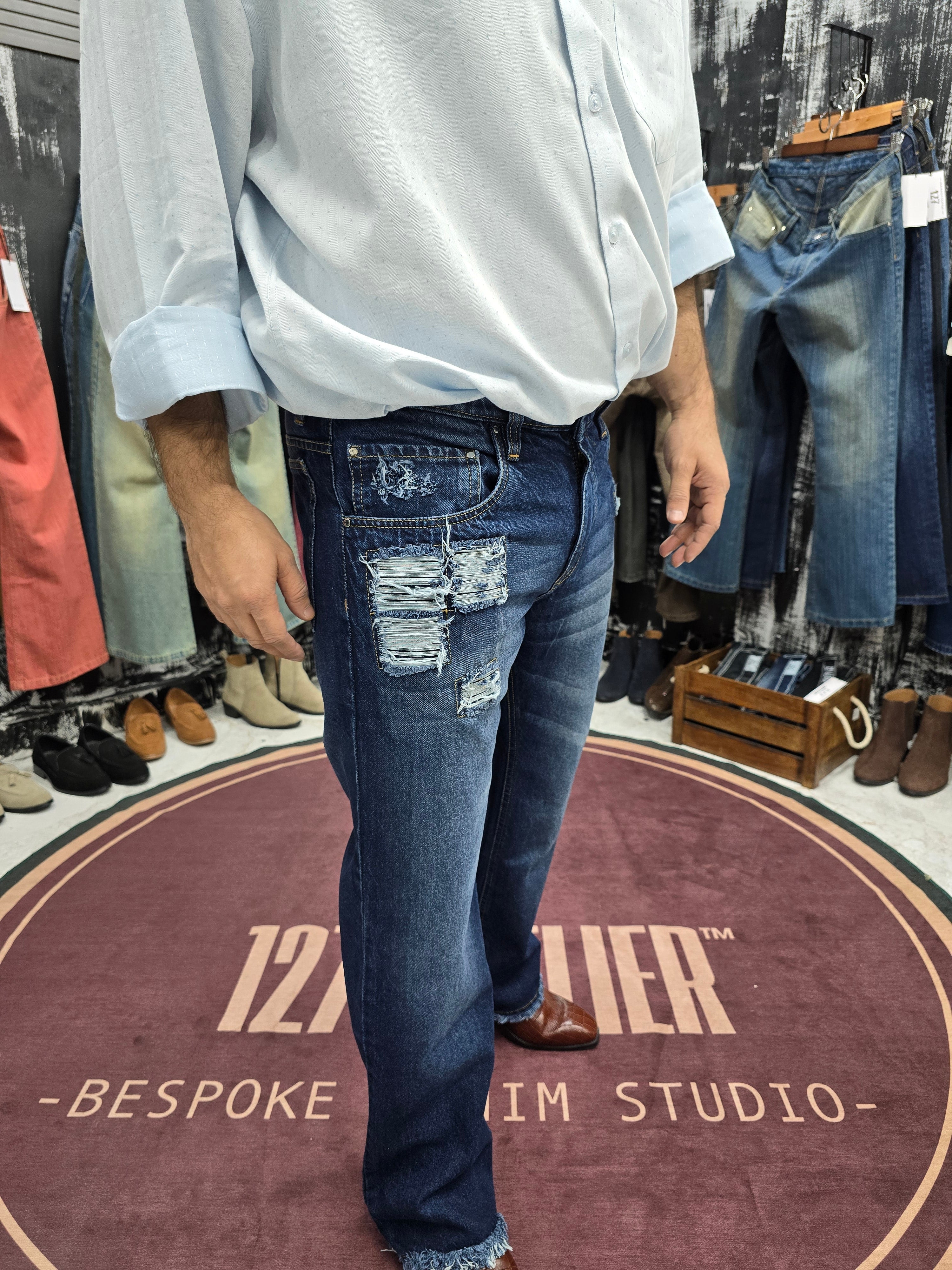 Distressed Indigo Semi Bootcut Jeans